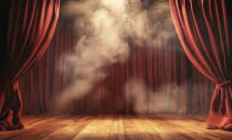 Theatrical stage with red curtains and dramatic fog